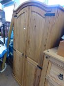 Vintage pine two door wardrobe, the top and doors of the wardrobe being arched, the doors being