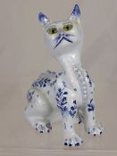 Delft style pottery cat having glass eyes.