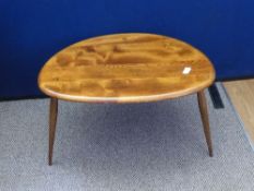 Vintage Ercol style three legged coffee table, being golden oak in colour, approx. 64 x 44 x 42