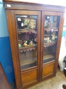 Mahogany Bookcase with glass doors and wooden shelves, approx. 102 x 29 x 155 cms.