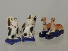 Antique Staffordshire Figures, including two reclining greyhounds, two spaniels and two cats