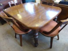 Victorian mahogany wind out dining table together with a set of six Victorian square back dining