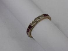 A Lady`s 18 ct Gold and Platinum Ruby and Diamond Full Eternity Ring, size R, 9 x rubies 3.8 x 2.