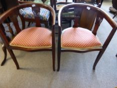 Pair of Victorian mahogany elbow chairs having pierced decoration to sides and back supports, the