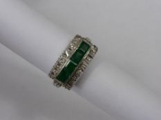 Lady`s Art Deco 18ct white gold emerald and diamond Ring, the four emeralds set in a central bar