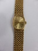 Lady`s 9ct Gold Bueche-Girod Dress Wrist Watch and Bracelet, the oval faced watch having gold baton