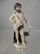 A Crown Derby antique figure of a classical gentleman 15 cms high. (waf)