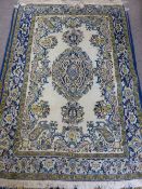 A Persian Carpet, with blue and gold floral design on cream ground approx 170 x 110cms