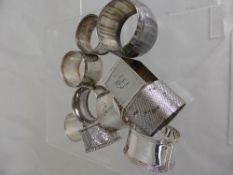 Ten Solid Silver Napkin Rings, various hallmarks, approx 270 gms.