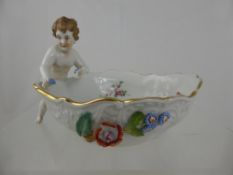 A Dresden Porcelain Bowl, with cherub figure support and raised floral decoration, nr 9921, factory