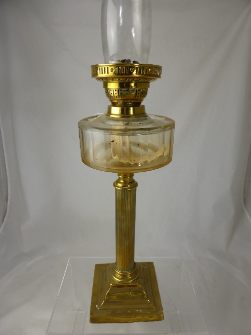 An antique brass Corinthian oil lamp