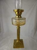 An antique brass Corinthian oil lamp