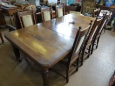 Victorian mahogany wind out dining table having two extra leaves, on part turned and reeded legs on