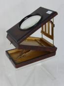 Victorian photo magnifier in a burr walnut case.