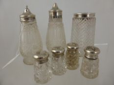 Cut Glass Salt, Pepper and Castor with silver tops, together with two further miniature cutglass