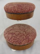 Two Victorian fruit wood footstools with pink upholstery on porcelain feet.
