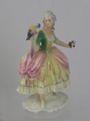 Carl Ens Figurine, depicting a figurine of a Lady and Parrot, factory marks to base, approx 25.5