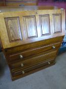 Oak effect bureau, the interior fitted with pigeon holes and shelves with three drawers below, on a