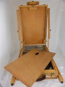 Artist`s wooden folding easel with integral paint box, approx. 41 x 55 x 17 cms. when folded.