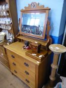 Arts and Crafts style waxed pine chest of drawers having a mirror above with three drawers having
