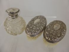 Two Silver Topped Brushes, together with a cut glass perfume bottle and a comb, Birmingham