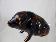 A vintage ceramic piggy bank in the form of a pig inscribed Kathleen Enid Ailmore, August 16th,