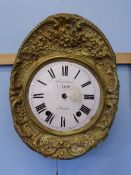 Brass faced wall hanging clock, white enamel dial with pendulum, P Lemy A Brons to face.