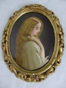 An original Oval Study on Porcelain, depicting a beautiful young woman, the painting presented in a