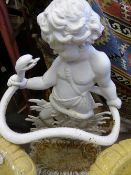 An antique cast iron umbrella stand, the white painted umbrella stand depicting a cherub wrestling