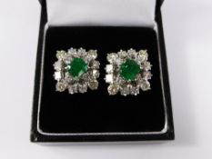 A pair of 18 carat yellow gold, emerald and diamond stud earrings, diamonds weight estimated 2.4