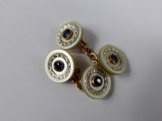 A pair of gentleman`s yellow gold sapphire and mother of pearl cuff  links.