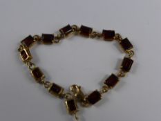 A Lady`s 9ct Gold Hallmark Garnet Bracelet, approx 10.3 gms 13 x 7 x 5 mm.