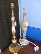 Two onyx table lamps, both having brown swirl decoration, one being approx. 47 cms. high, the other