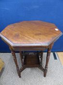 Victorian mahogany octagonal occasional table having four turned columns supporting an under shelf,