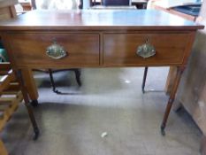 Victorian mahogany writing table having two drawers with brass drop handles on turned legs and