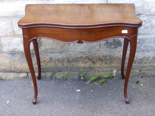 A Regency  style card table on tapered legs with box stringing and inlay to top, side and legs,