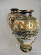 A pair of Satsuma Vases with cobalt blue background, the vases depicting mountain scenes, WAF.