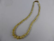 Lady`s Antique Graduated Unusual White Stone Necklace, 9ct clasp, 35 cms.