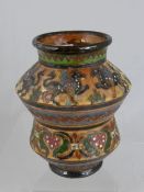 An Italian pottery vase depicting griffins signed Pucci 105 Montoroli 20.5 cms high.