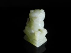 Chinese 20th Century Pale Celadon Jade Foo Dog, the figure featuring an ornately carved mane and