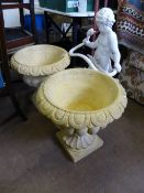 Pair of composite stone garden urns, approx. height including plinth 50 cms. approx. diameter 50