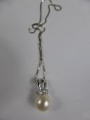 A Lady`s 18ct Pearl and White Stone Necklace, suspended on a fine 750 hallmark chain,approx 3.2