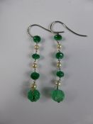 A pair of lady`s white gold, emerald and pearl drop earrings, total estimated emerald 8 cts.