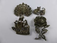 Four Marcasite Brooches, in the form of a kitten, peacock, ship and flower.