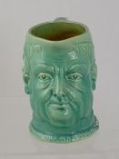 A Watkin South Devon pottery character mug, approximately 14 cms high.