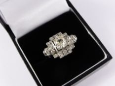 A lady`s 18 carat white gold art deco style diamond ring, the ring having a central diamond of 1.2