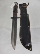 Second World War commando knife with black leather sheath.