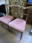 Pair of antique bar back bedroom chairs having scroll decoration to the bars, the front legs being