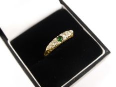 A Lady`s 18 ct Yellow Gold and Platinum Diamond and Green Stone Ring, size O, approx 3.7 gms. 15