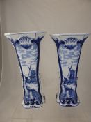 A pair of Delft vases the vases depicting flowers and windmill scenes inscribed"" delft dec 510 A""